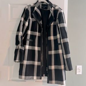 Long plaid jacket with faux leather trim